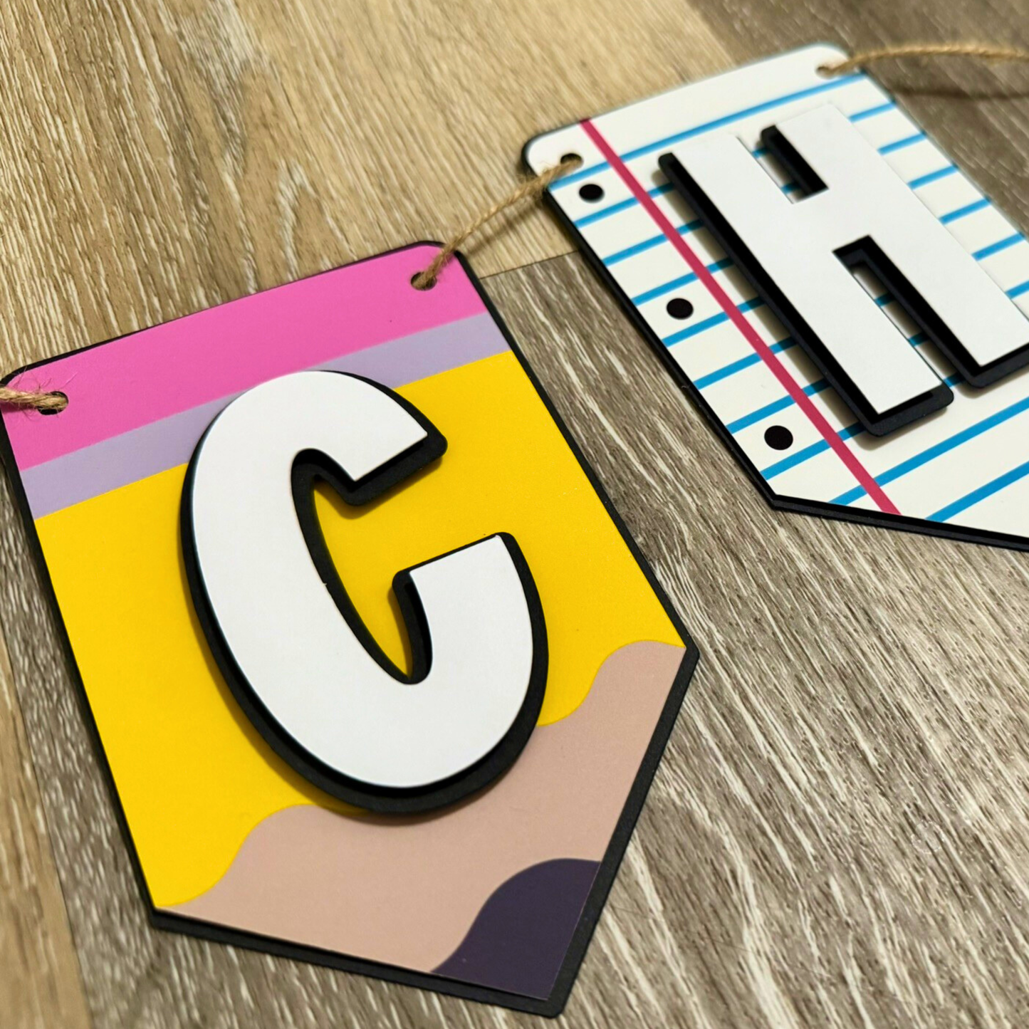 Colorful letter 'C' on a wooden surface