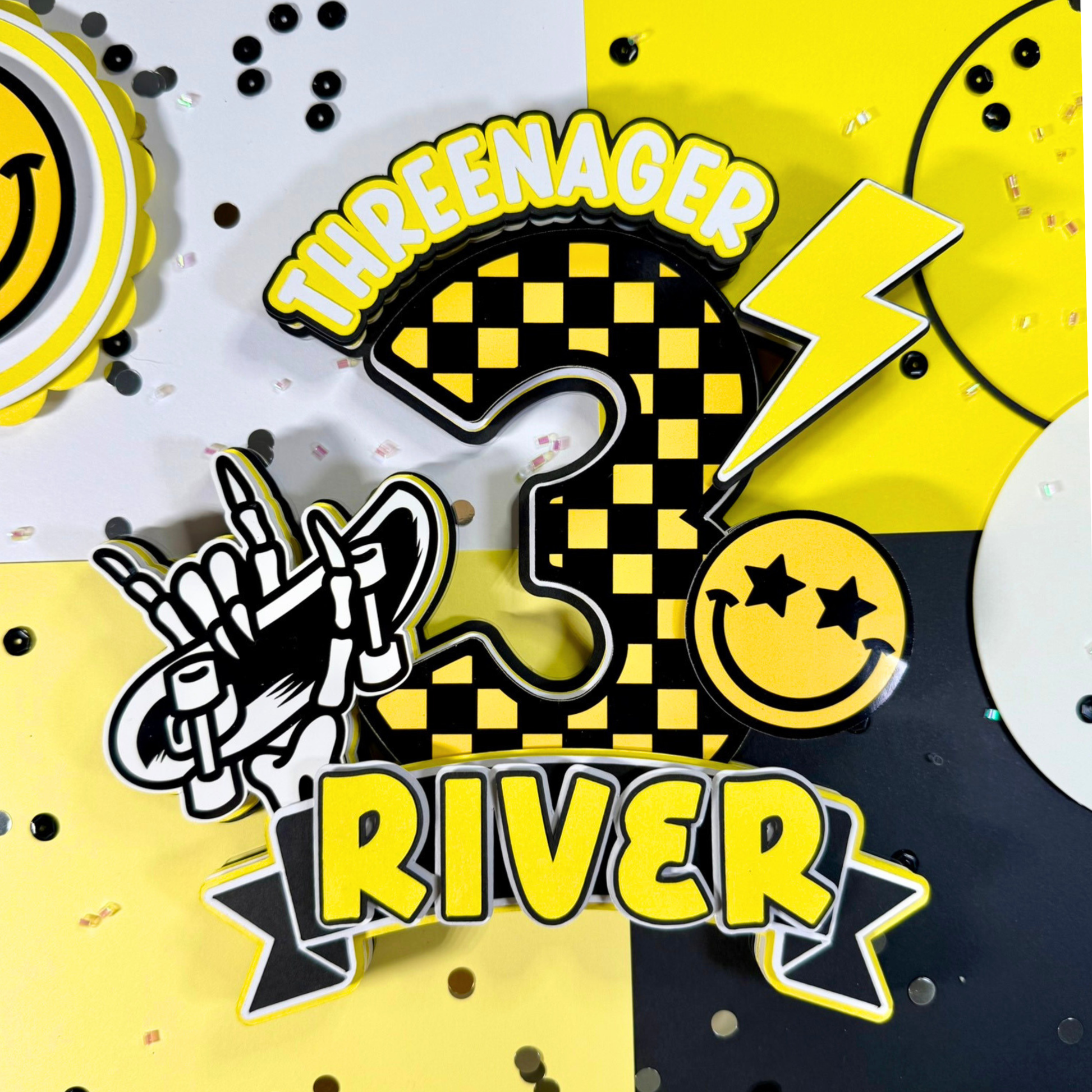 Decorative elements with 'THREE' in a checkered pattern, lightning bolt, hand gesture, and smiley face on a multicolored background.