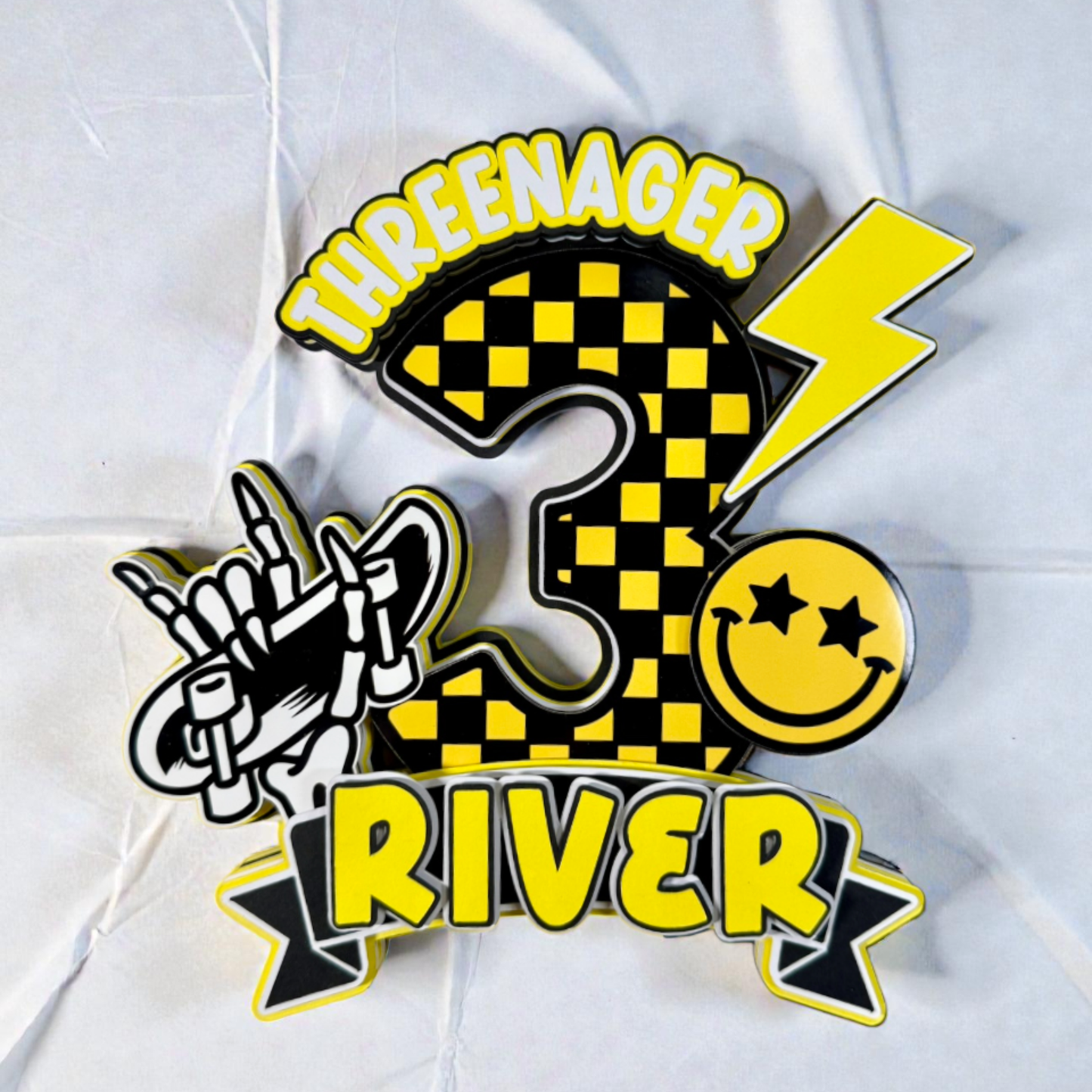 Colorful number '3' with checkered pattern, lightning bolt, and smiley face on a white background