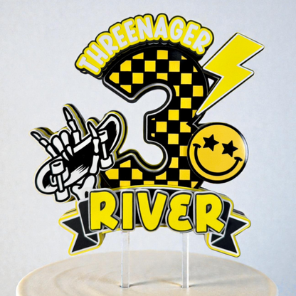 Personalized birthday cake topper with checkered design, lightning bolt, and text on a white background